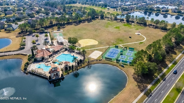 birds eye view of property with a water view