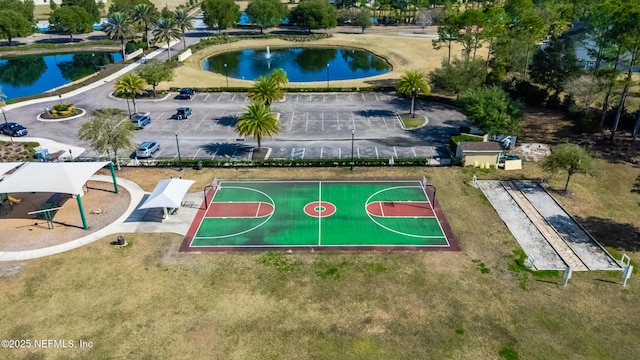 view of basketball court featuring a water view