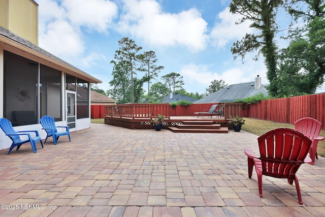 view of patio with a sunroom and a deck