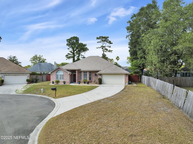 ranch-style home with a garage and a front lawn