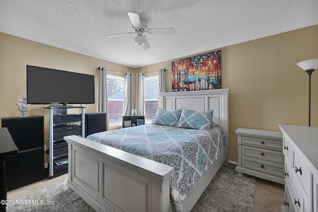 bedroom featuring a textured ceiling and ceiling fan