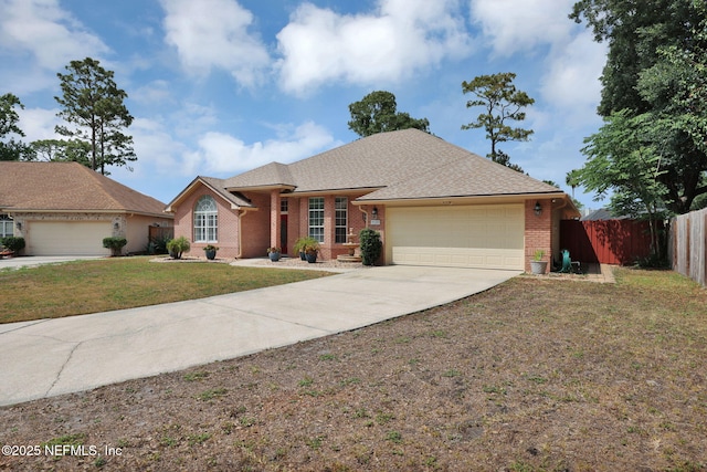 ranch-style home featuring a garage and a front yard