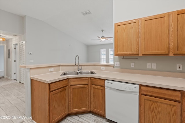 kitchen featuring sink, vaulted ceiling, light hardwood / wood-style flooring, white dishwasher, and kitchen peninsula