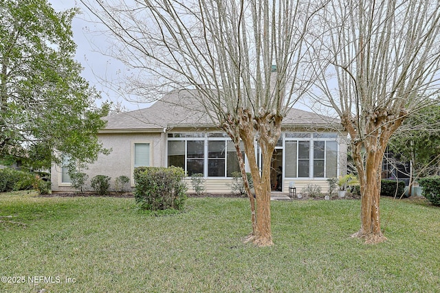 back of house featuring a yard