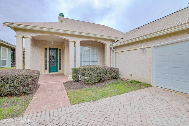property entrance with a garage