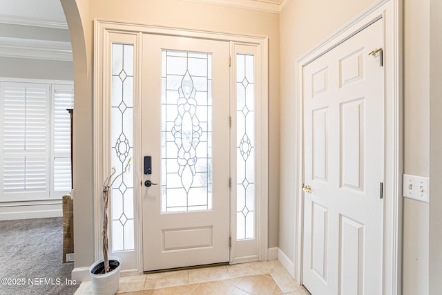 tiled entrance foyer with ornamental molding