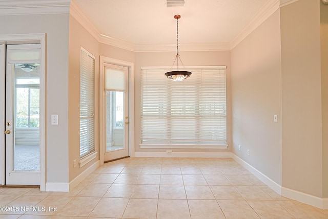 unfurnished dining area with light tile patterned flooring and ornamental molding