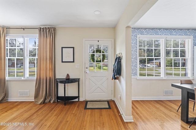 entrance foyer with light hardwood / wood-style floors