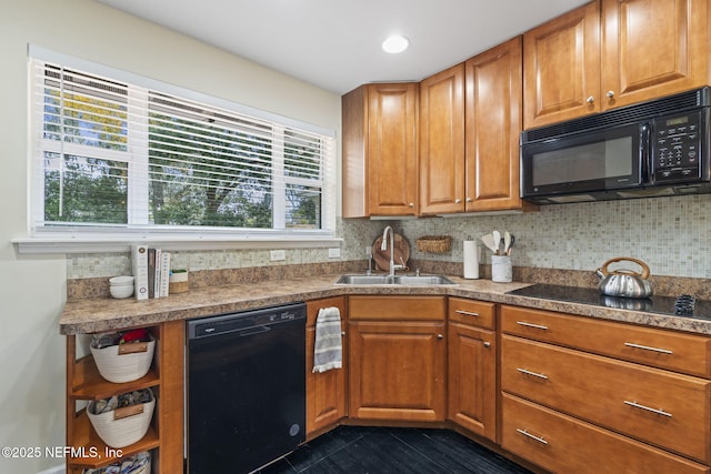 kitchen featuring backsplash, sink, and black appliances