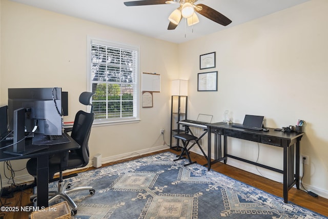 home office featuring hardwood / wood-style flooring and ceiling fan