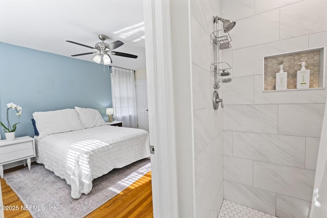 bedroom featuring hardwood / wood-style flooring and ceiling fan