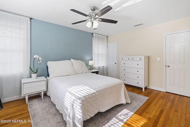 bedroom with hardwood / wood-style flooring and ceiling fan