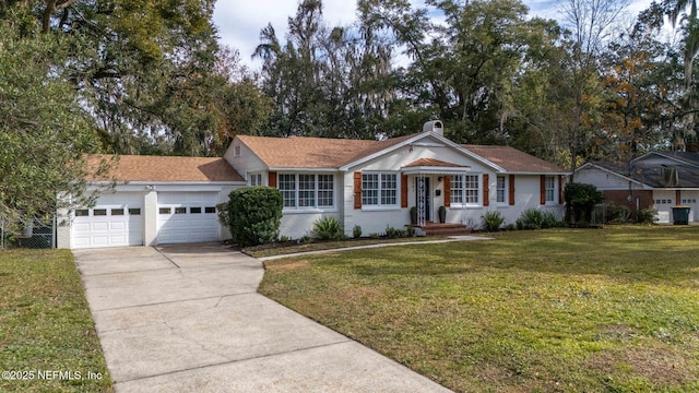 ranch-style house featuring a garage and a front yard