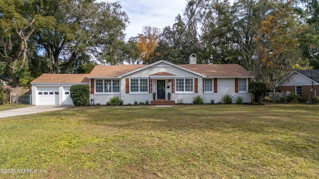 ranch-style house featuring a garage and a front lawn