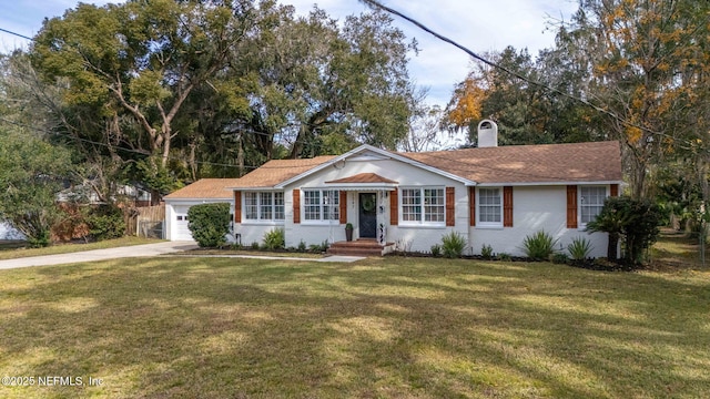 single story home with a garage and a front yard