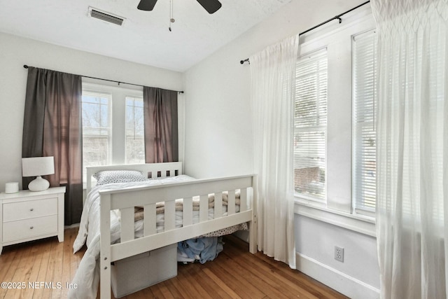 bedroom featuring ceiling fan and light hardwood / wood-style floors