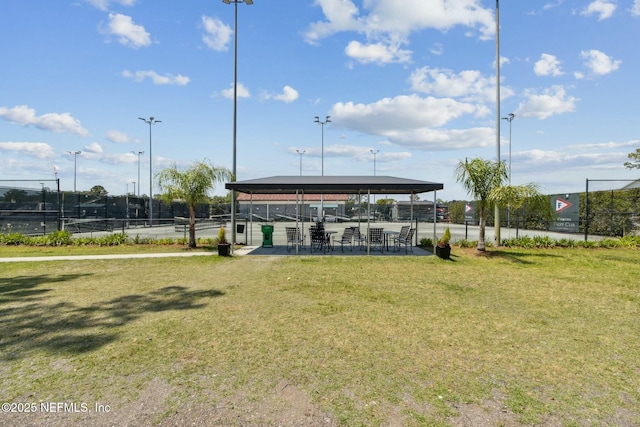 view of property's community featuring a yard