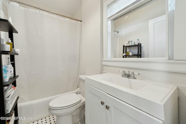 full bathroom featuring vanity, shower / bath combo, and toilet