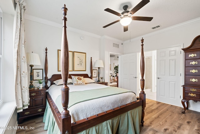 bedroom with crown molding, ceiling fan, and light wood-type flooring