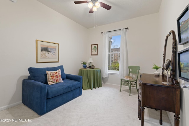 sitting room with light carpet and ceiling fan