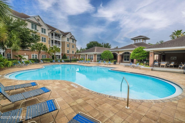 view of swimming pool with a patio area