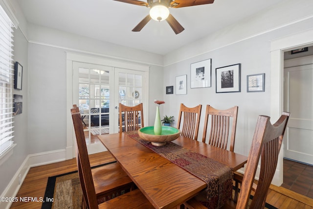 dining space with ceiling fan and dark hardwood / wood-style floors