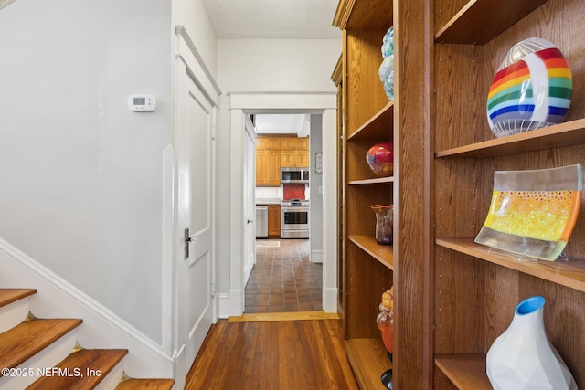 corridor with dark wood-type flooring