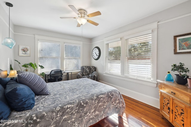 bedroom featuring ceiling fan and dark hardwood / wood-style flooring