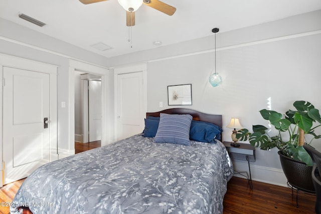 bedroom featuring ceiling fan and dark hardwood / wood-style flooring