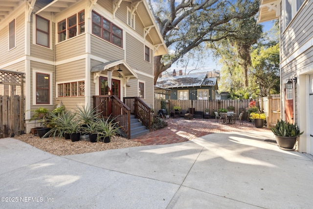 view of side of home with a patio