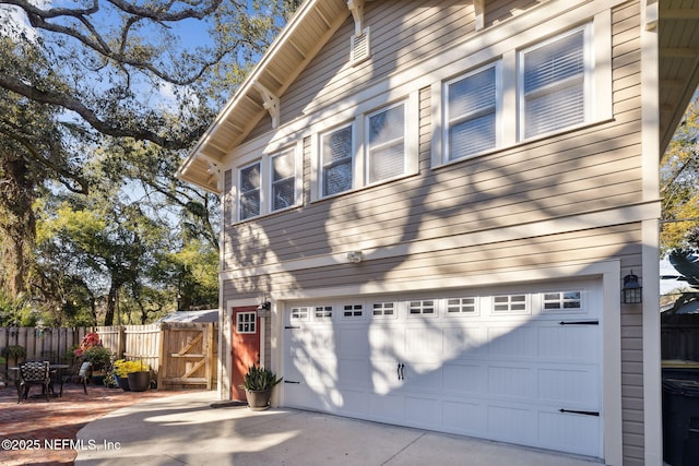 view of side of home with a garage