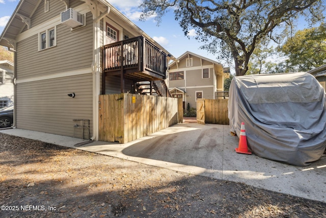 view of side of home featuring a deck