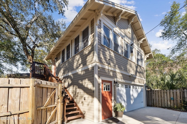 view of side of home with a garage