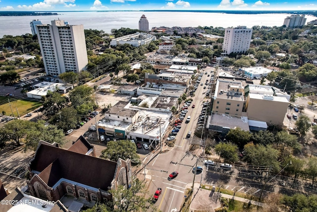 birds eye view of property with a water view