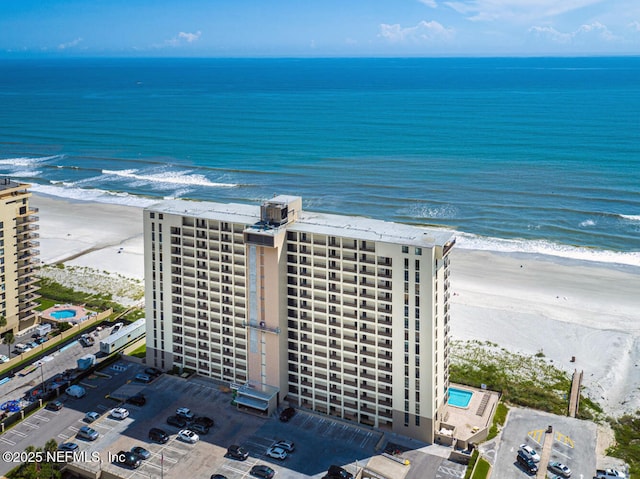 aerial view featuring a water view and a view of the beach