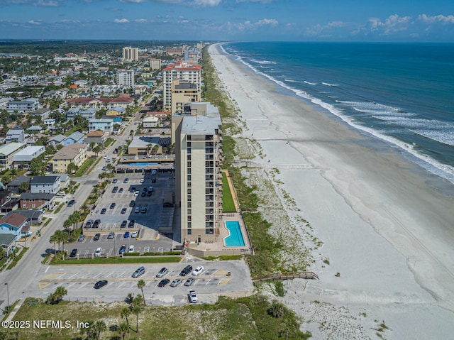 aerial view featuring a view of the beach and a water view