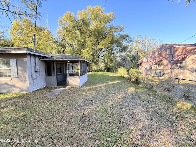 view of yard featuring a sunroom