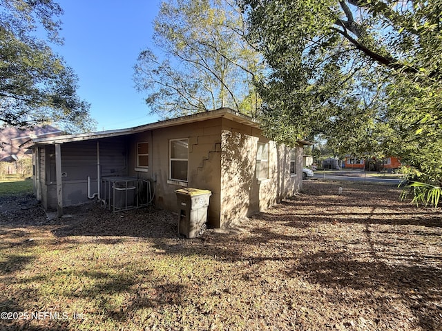 back of property featuring cooling unit