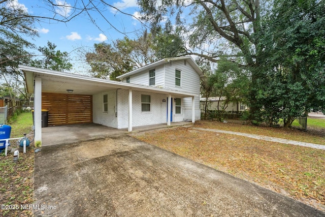 view of front of home featuring a carport