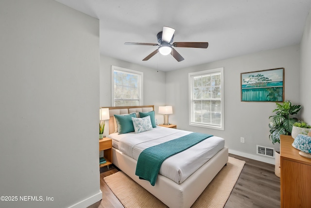 bedroom with wood-type flooring and ceiling fan