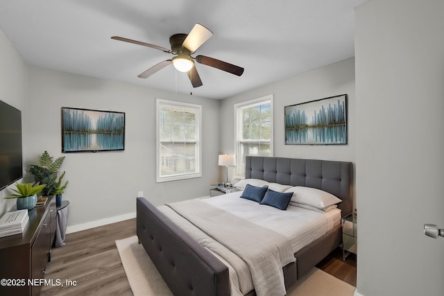 bedroom featuring dark hardwood / wood-style floors and ceiling fan