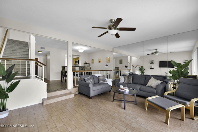 living room featuring ceiling fan