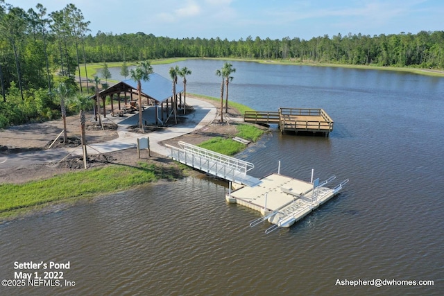 exterior space featuring a gazebo and a water view