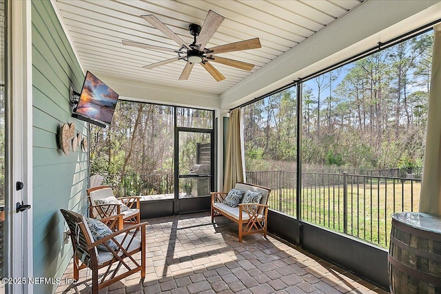 sunroom / solarium with ceiling fan