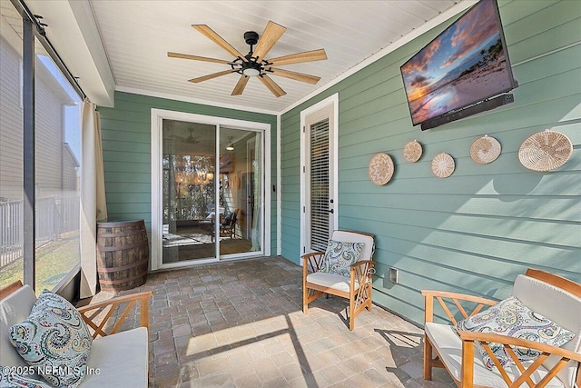 sunroom featuring wood ceiling and ceiling fan