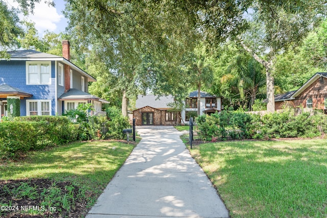 view of home's community featuring a yard