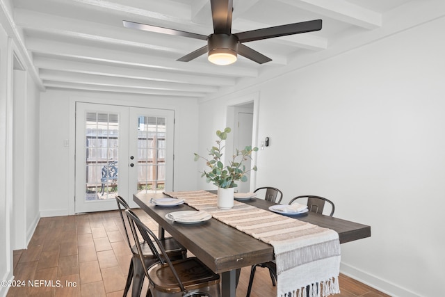 dining room featuring beam ceiling, ceiling fan, and french doors