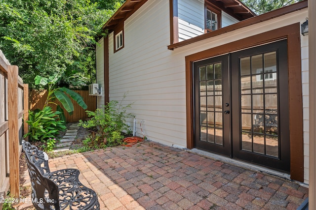 entrance to property with french doors and a patio