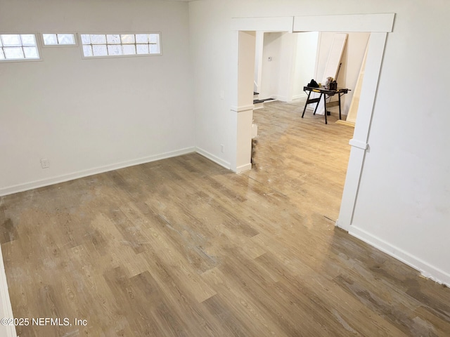 spare room with wood-type flooring