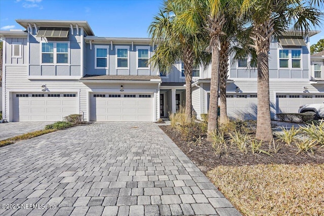 townhome / multi-family property featuring a garage